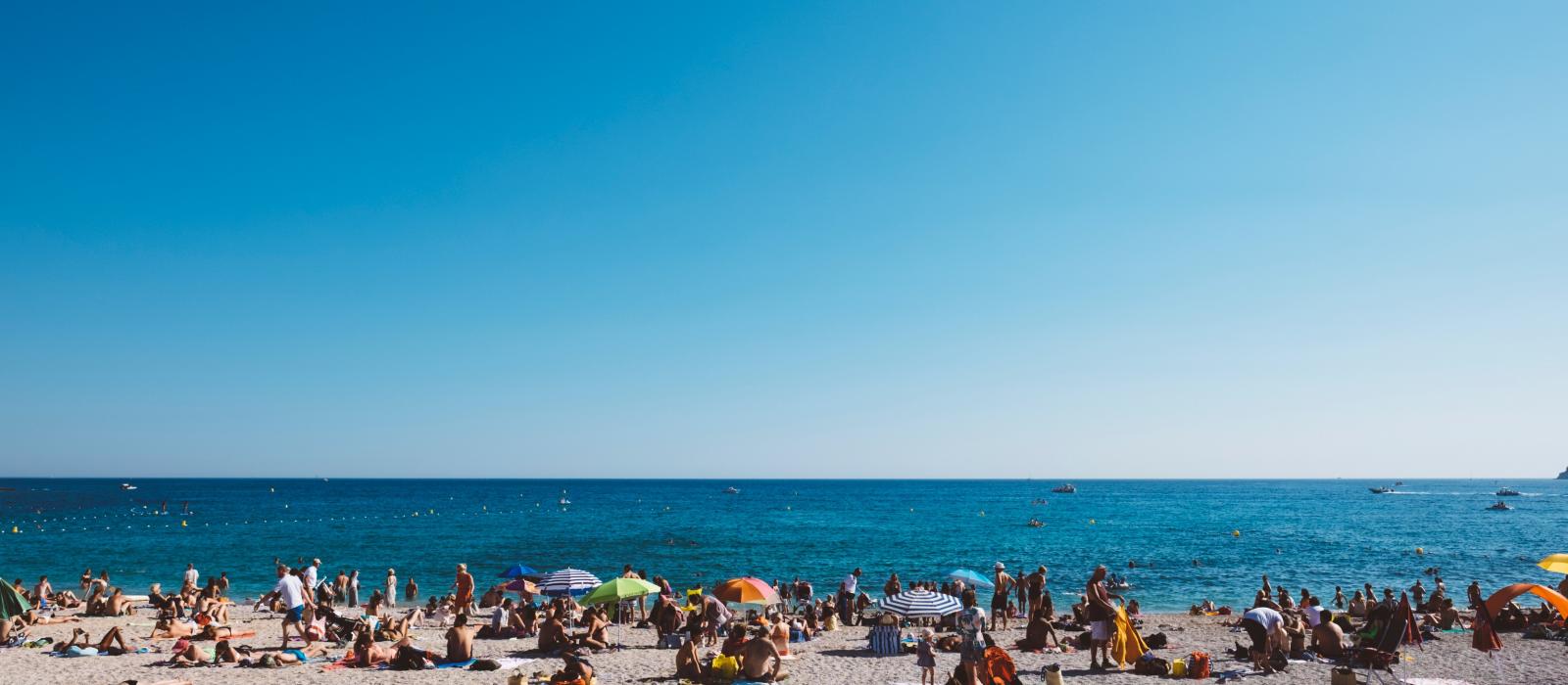 Holiday makers enjoy the beach