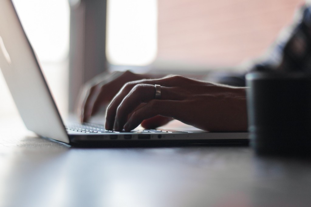 Hands typing on keyboard