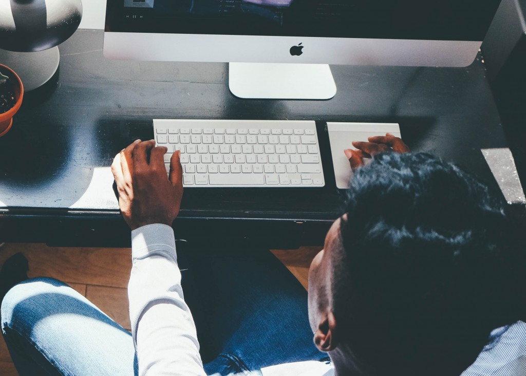 blogger writing on computer