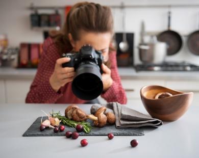 Woman photographs food